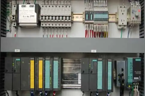 Control panel with switches and wires for industrial machinery.